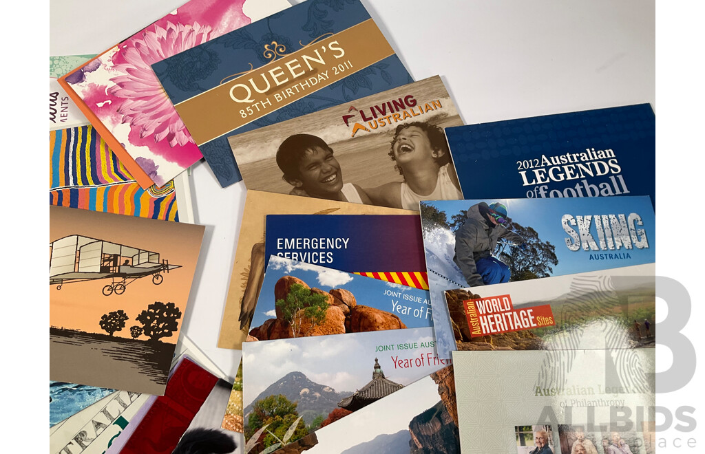 Fifty Six Australian Mint Stamp Packs Including Queensland 150 Years, Stargazing, Species at Risk, with Love, Beijing 2008, Gorgeous Australia, Living Green, Australian Commonwealth Coinage and More Face Value Approximately $217