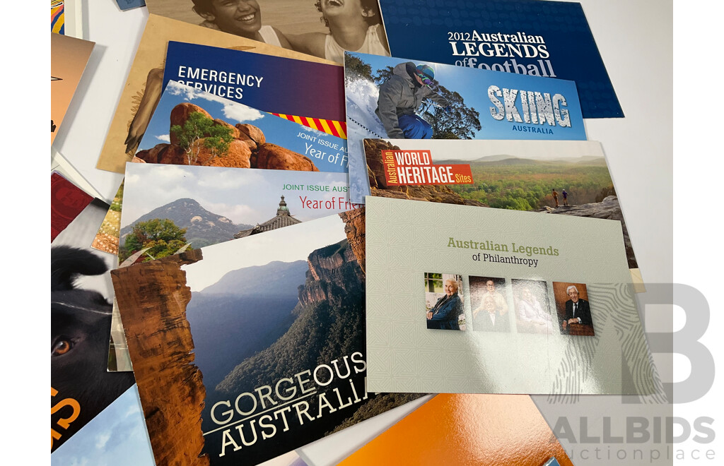 Fifty Six Australian Mint Stamp Packs Including Queensland 150 Years, Stargazing, Species at Risk, with Love, Beijing 2008, Gorgeous Australia, Living Green, Australian Commonwealth Coinage and More Face Value Approximately $217