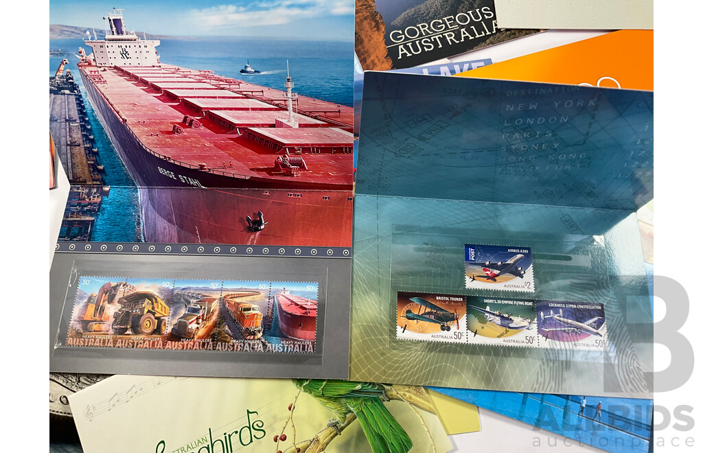 Fifty Six Australian Mint Stamp Packs Including Queensland 150 Years, Stargazing, Species at Risk, with Love, Beijing 2008, Gorgeous Australia, Living Green, Australian Commonwealth Coinage and More Face Value Approximately $217