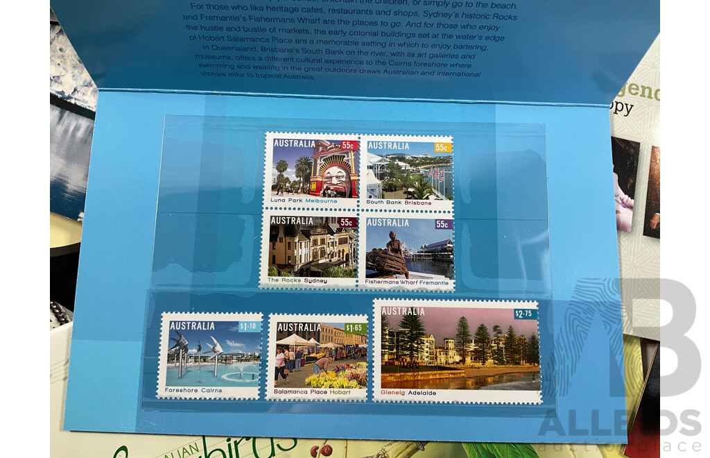 Fifty Six Australian Mint Stamp Packs Including Queensland 150 Years, Stargazing, Species at Risk, with Love, Beijing 2008, Gorgeous Australia, Living Green, Australian Commonwealth Coinage and More Face Value Approximately $217