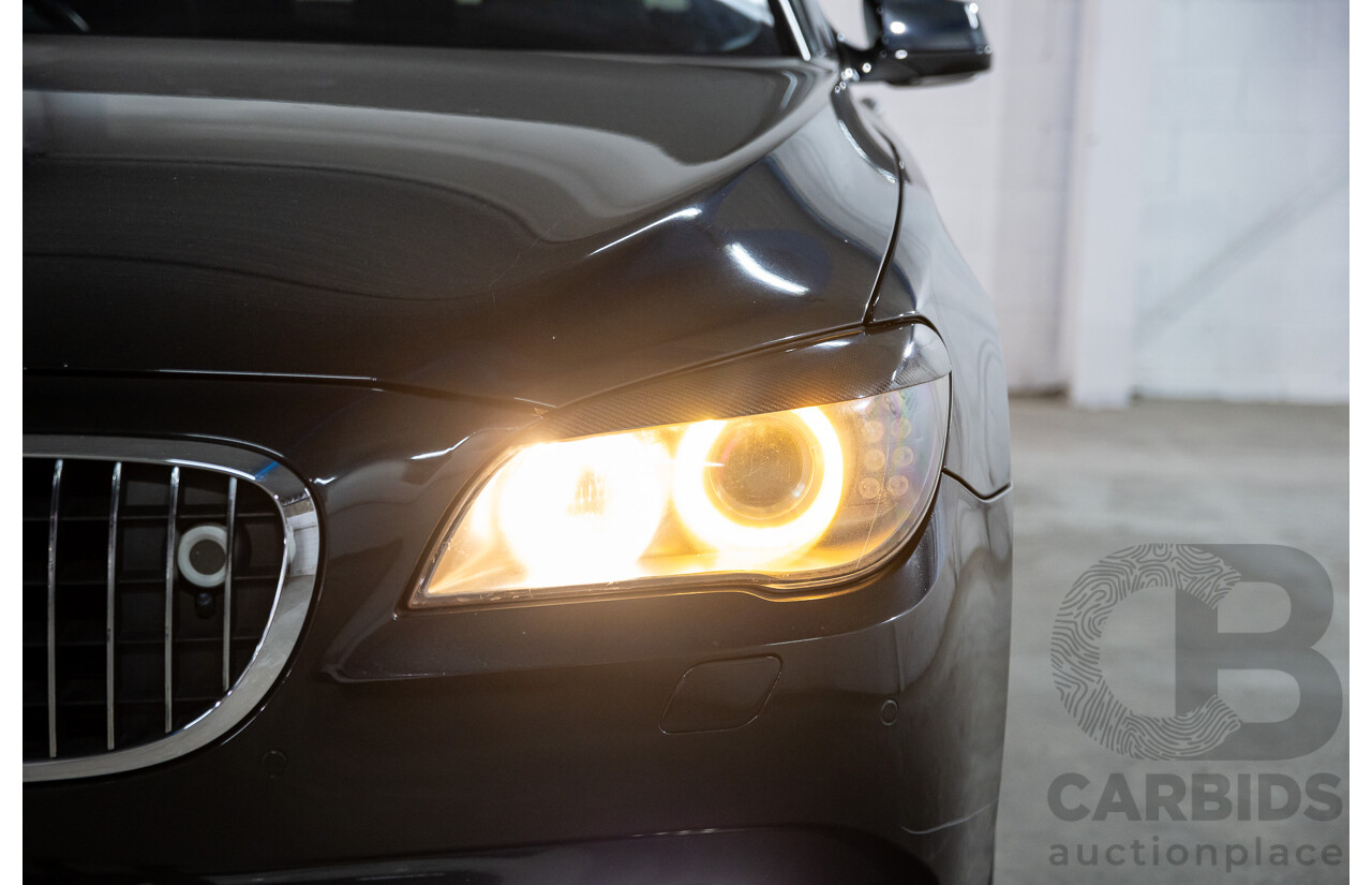 2/2010 BMW 750i F01 4d Sedan Sapphire Black Metallic Twin Turbo V8 4.4L