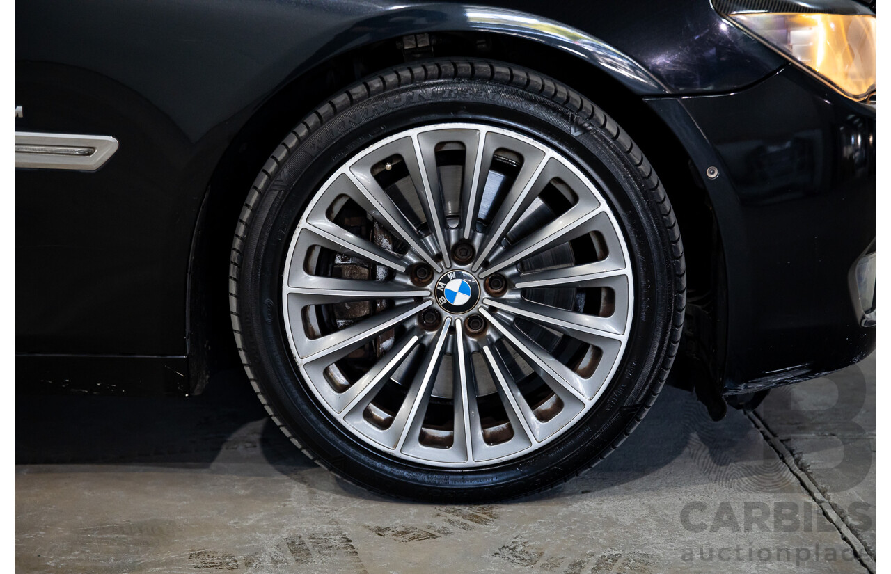 2/2010 BMW 750i F01 4d Sedan Sapphire Black Metallic Twin Turbo V8 4.4L