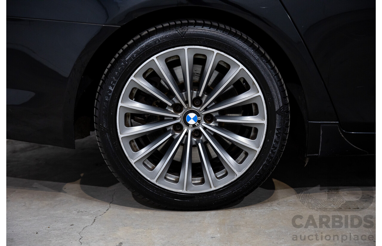 2/2010 BMW 750i F01 4d Sedan Sapphire Black Metallic Twin Turbo V8 4.4L