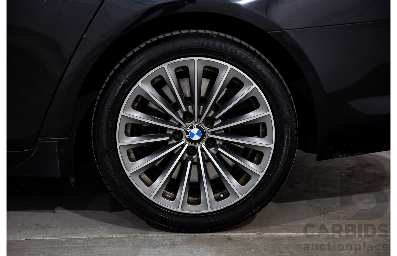 2/2010 BMW 750i F01 4d Sedan Sapphire Black Metallic Twin Turbo V8 4.4L