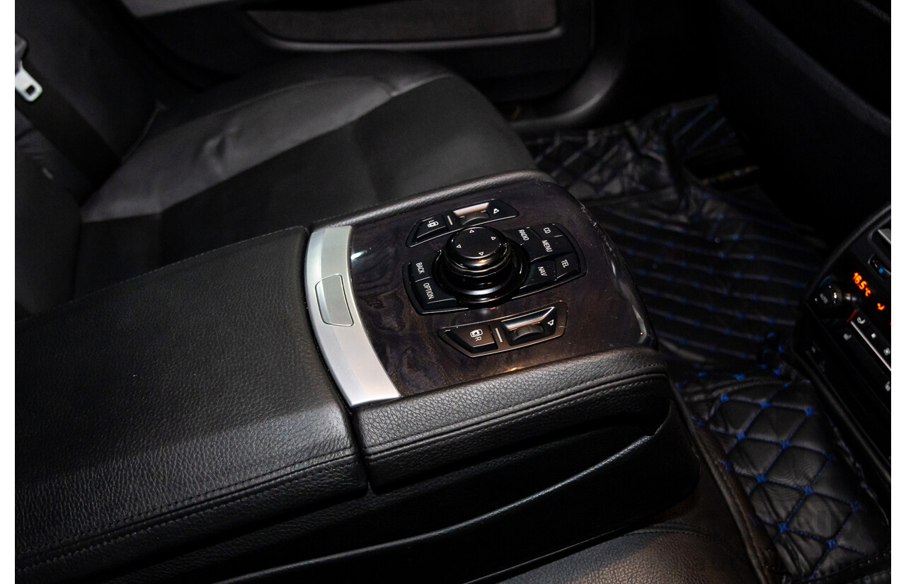 2/2010 BMW 750i F01 4d Sedan Sapphire Black Metallic Twin Turbo V8 4.4L