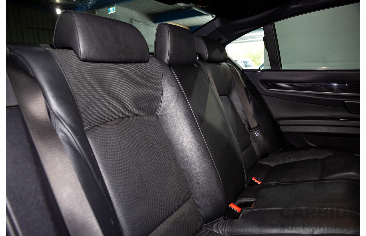 2/2010 BMW 750i F01 4d Sedan Sapphire Black Metallic Twin Turbo V8 4.4L