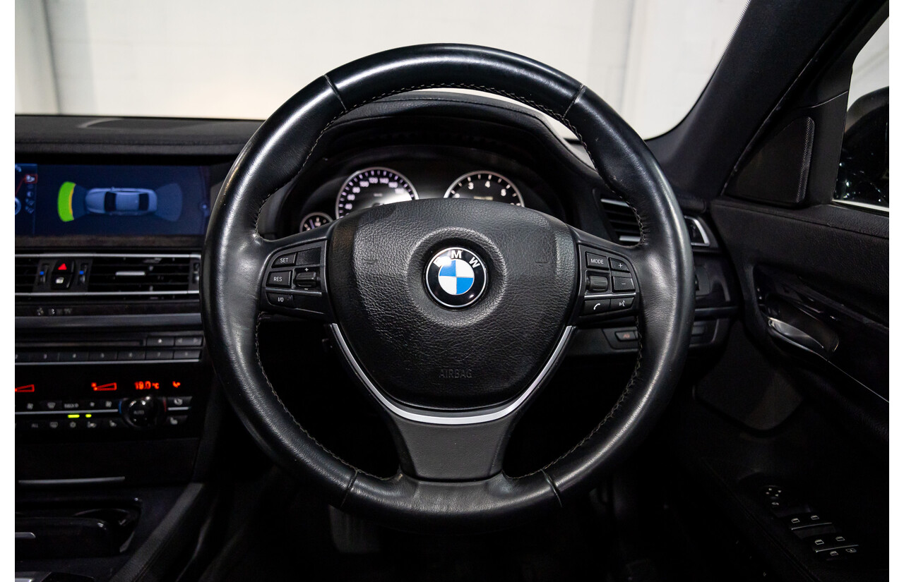 2/2010 BMW 750i F01 4d Sedan Sapphire Black Metallic Twin Turbo V8 4.4L