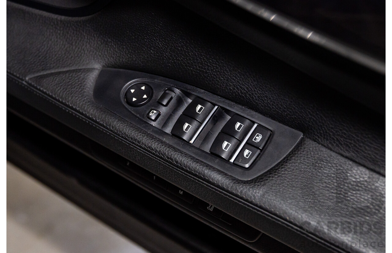 2/2010 BMW 750i F01 4d Sedan Sapphire Black Metallic Twin Turbo V8 4.4L