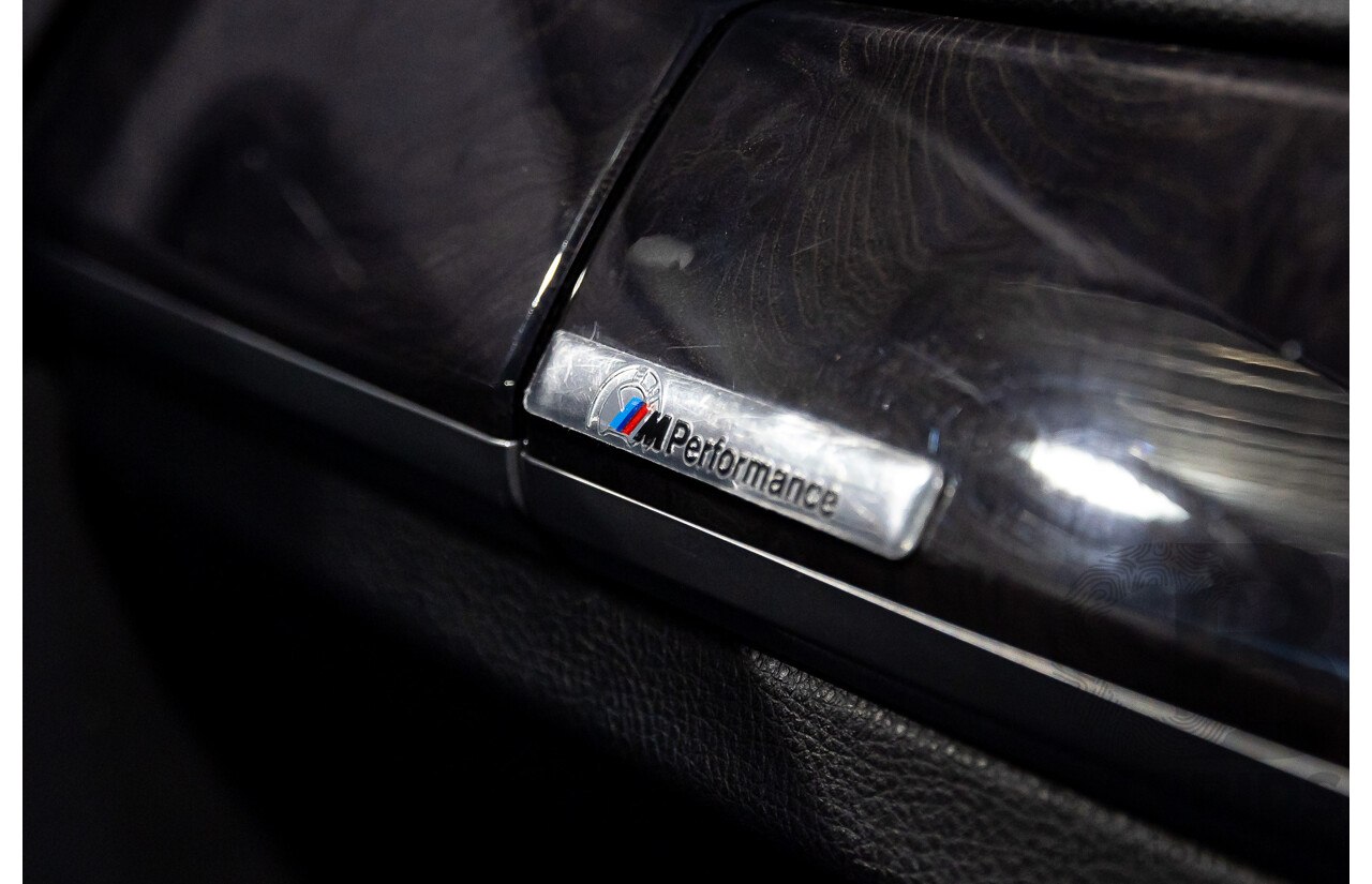 2/2010 BMW 750i F01 4d Sedan Sapphire Black Metallic Twin Turbo V8 4.4L