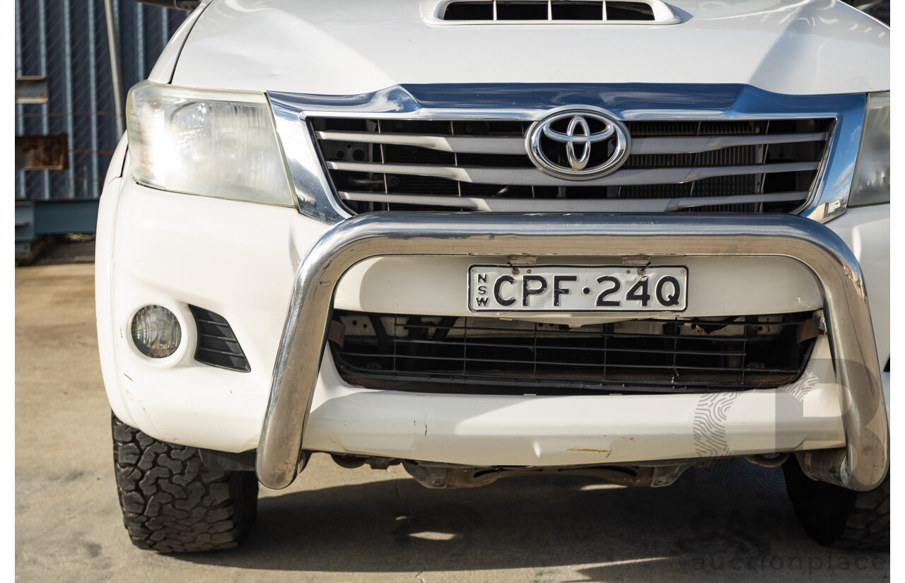 02/2013 Toyota Hilux SR5 (4x4) KUN26R MY12 Dual Cab Trayback Ute White 3.0L