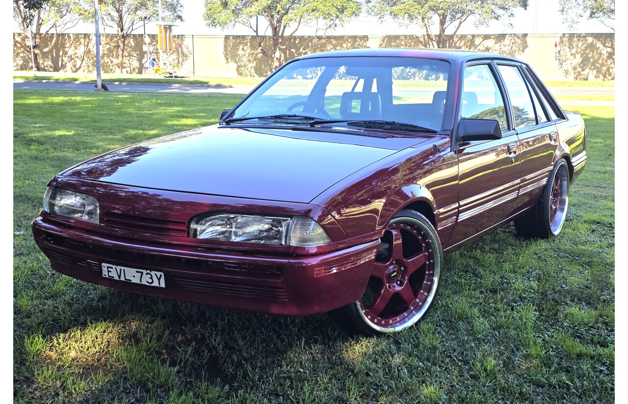 04/1987 Holden VL Commodore Executive 4d Sedan Burgundy V8 5.0L - Modified