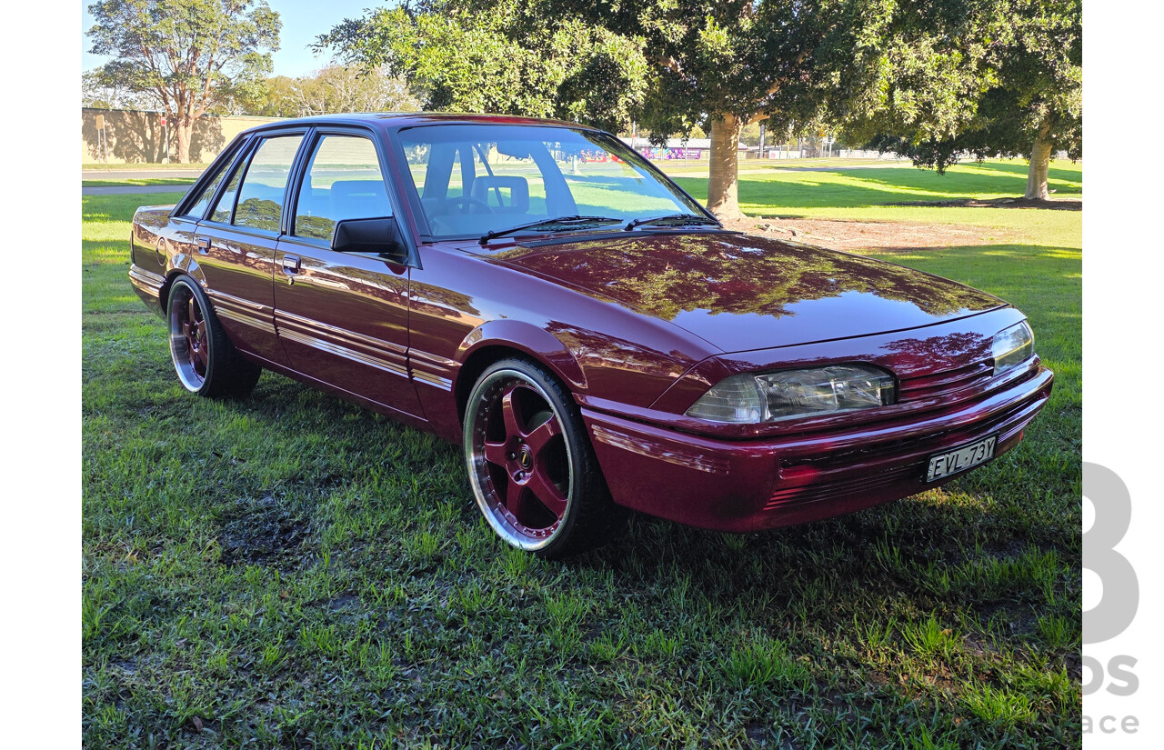 04/1987 Holden VL Commodore Executive 4d Sedan Burgundy V8 5.0L - Modified