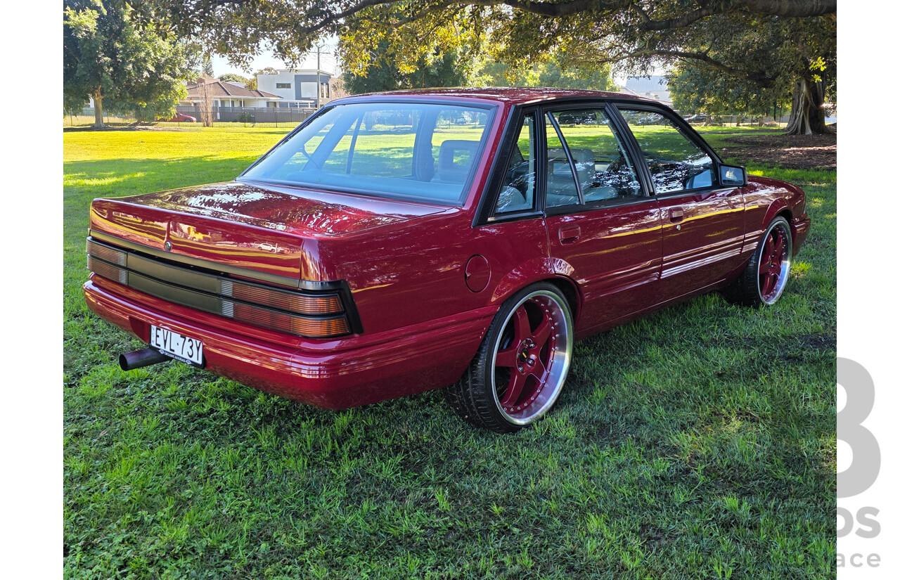 04/1987 Holden VL Commodore Executive 4d Sedan Burgundy V8 5.0L - Modified
