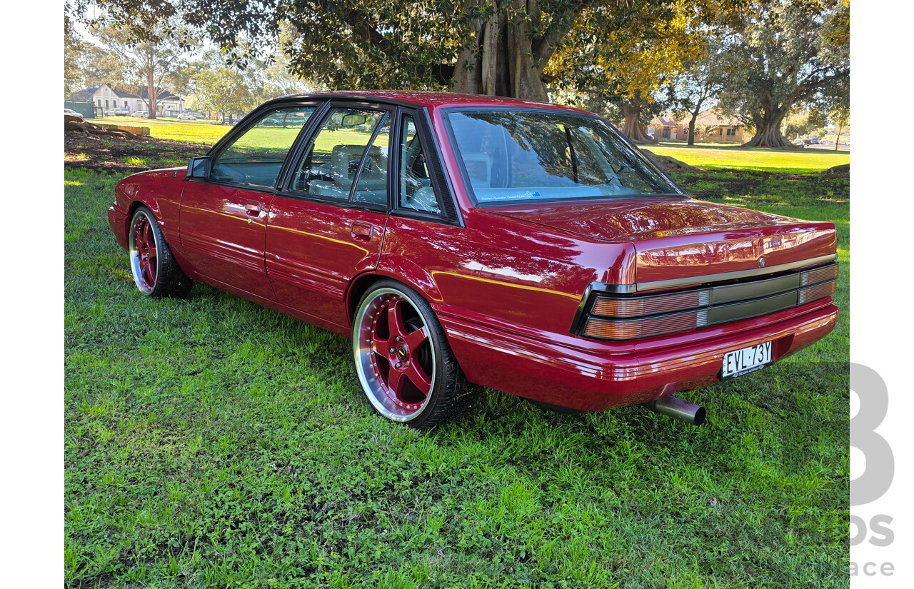 04/1987 Holden VL Commodore Executive 4d Sedan Burgundy V8 5.0L - Modified
