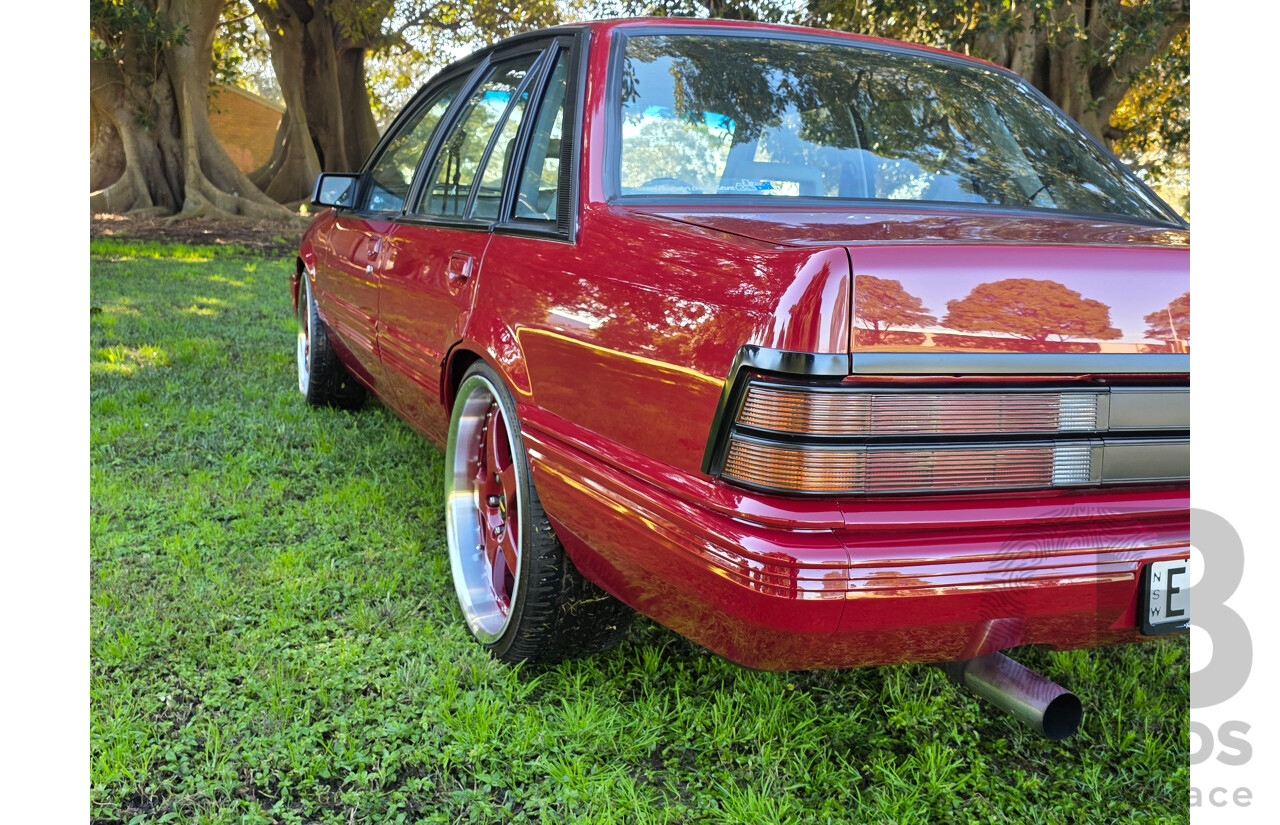 04/1987 Holden VL Commodore Executive 4d Sedan Burgundy V8 5.0L - Modified