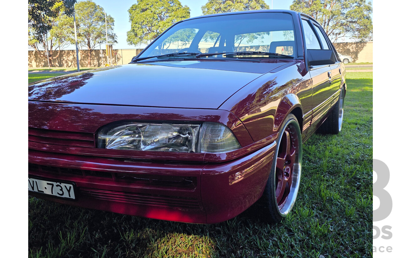 04/1987 Holden VL Commodore Executive 4d Sedan Burgundy V8 5.0L - Modified