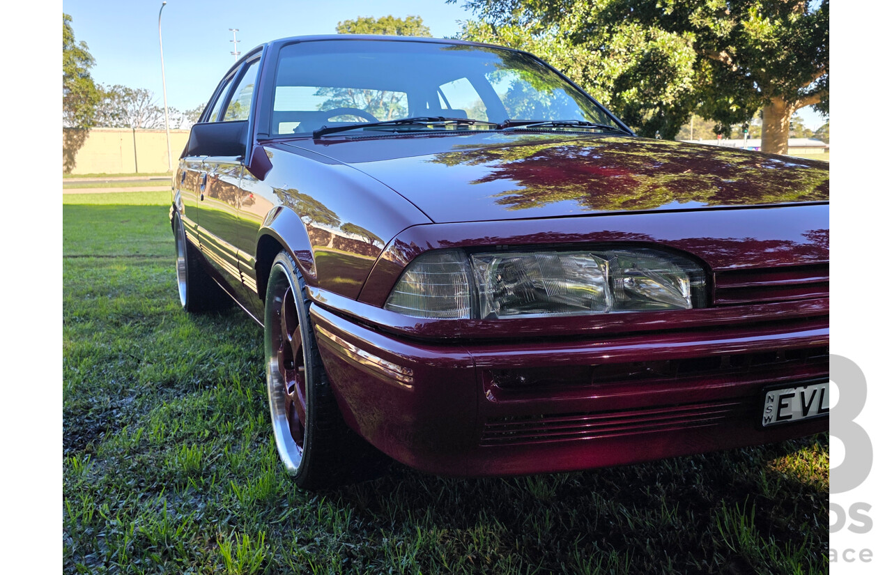 04/1987 Holden VL Commodore Executive 4d Sedan Burgundy V8 5.0L - Modified