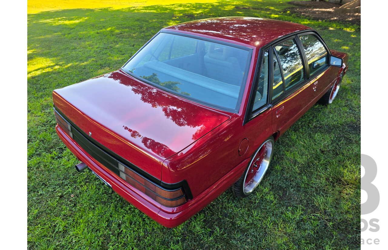 04/1987 Holden VL Commodore Executive 4d Sedan Burgundy V8 5.0L - Modified