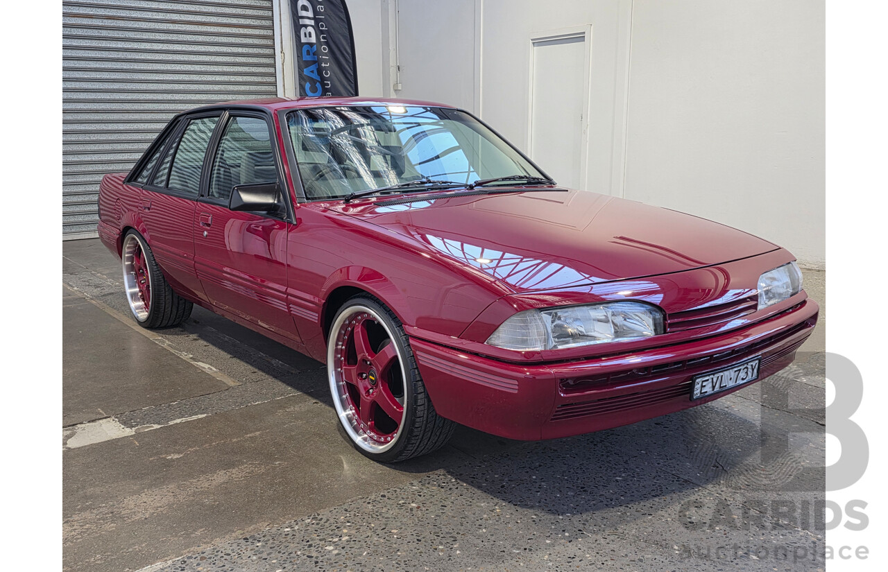 04/1987 Holden VL Commodore Executive 4d Sedan Burgundy V8 5.0L - Modified