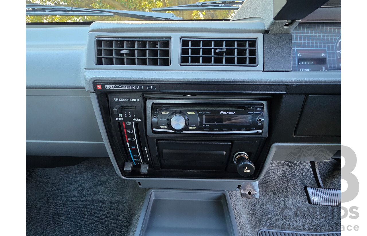 04/1987 Holden VL Commodore Executive 4d Sedan Burgundy V8 5.0L - Modified