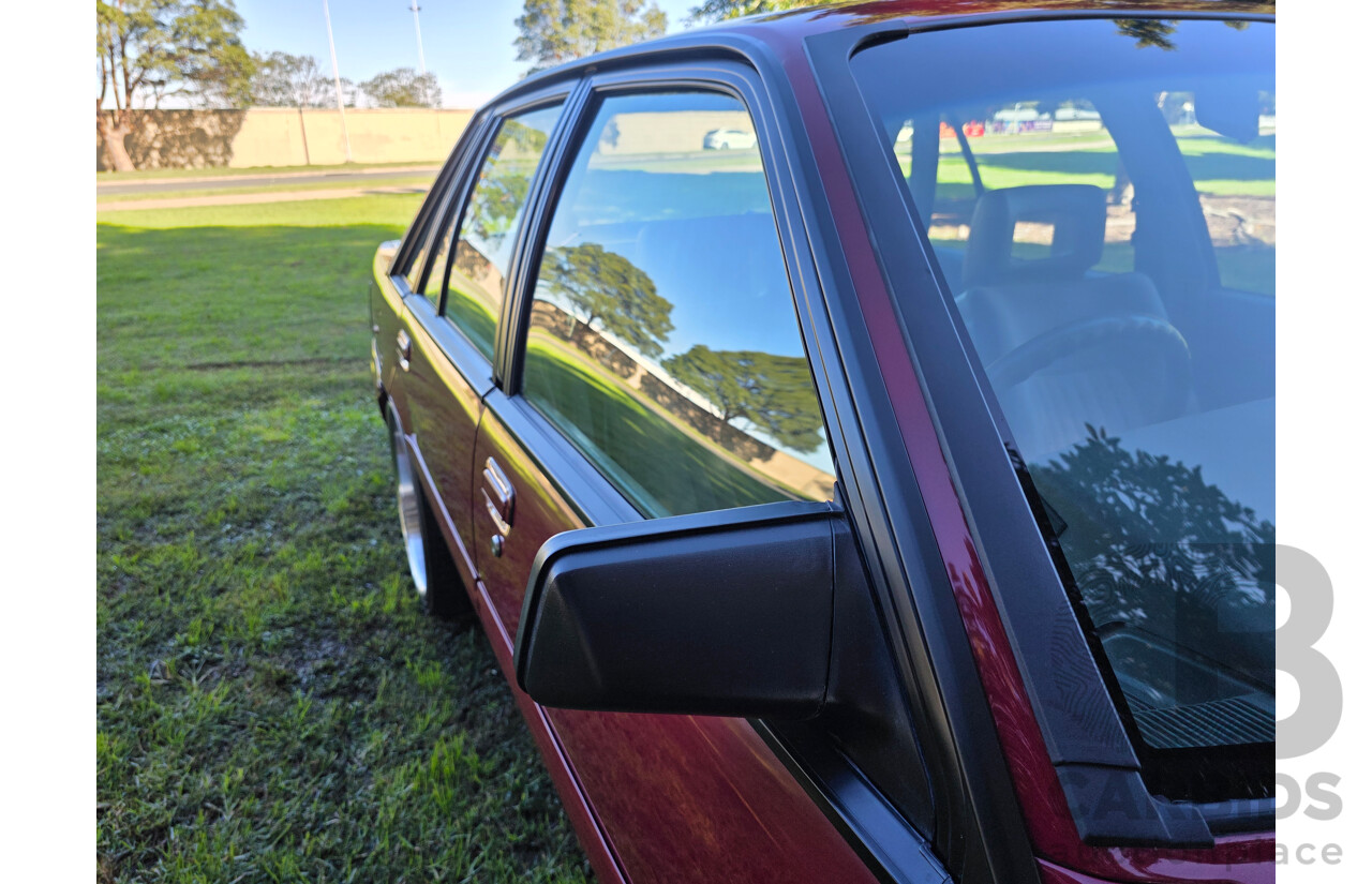 04/1987 Holden VL Commodore Executive 4d Sedan Burgundy V8 5.0L - Modified