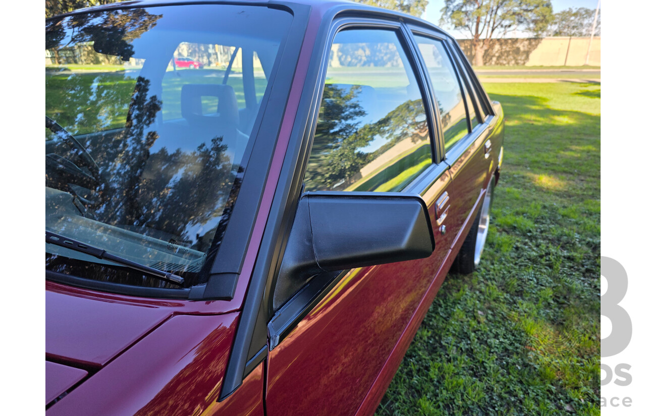 04/1987 Holden VL Commodore Executive 4d Sedan Burgundy V8 5.0L - Modified