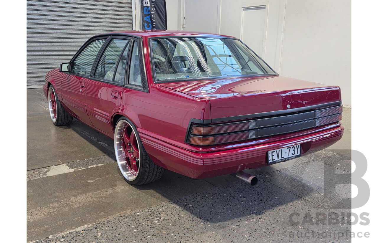 04/1987 Holden VL Commodore Executive 4d Sedan Burgundy V8 5.0L - Modified