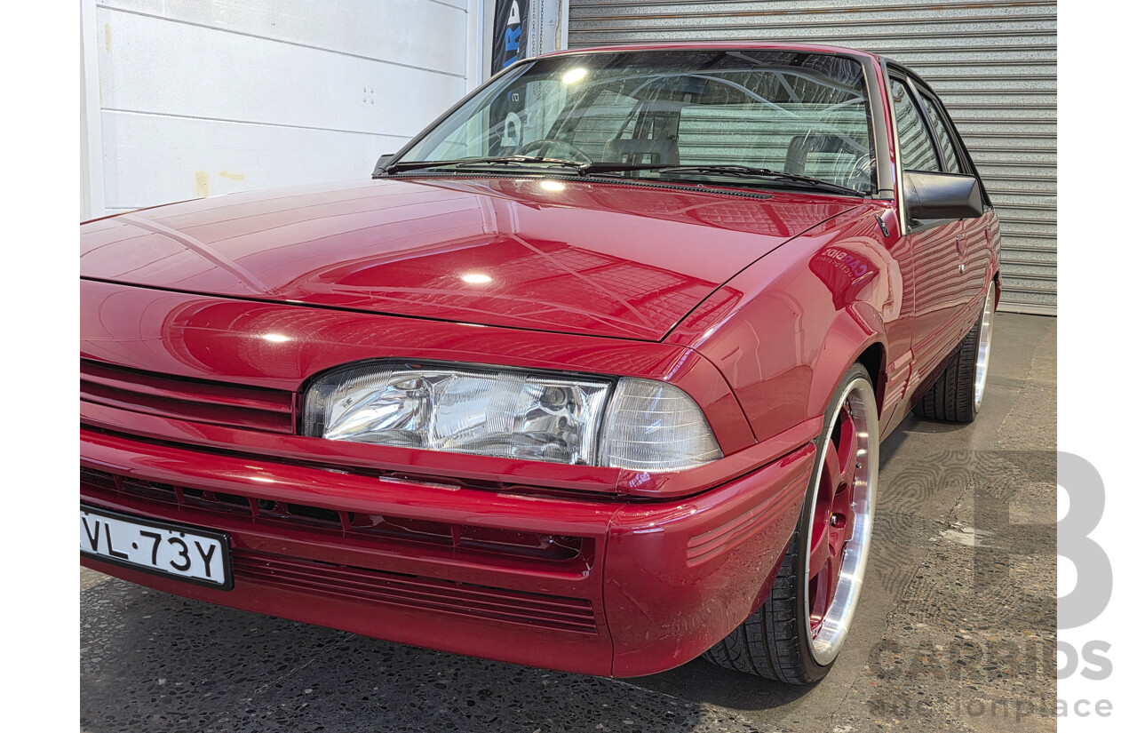 04/1987 Holden VL Commodore Executive 4d Sedan Burgundy V8 5.0L - Modified
