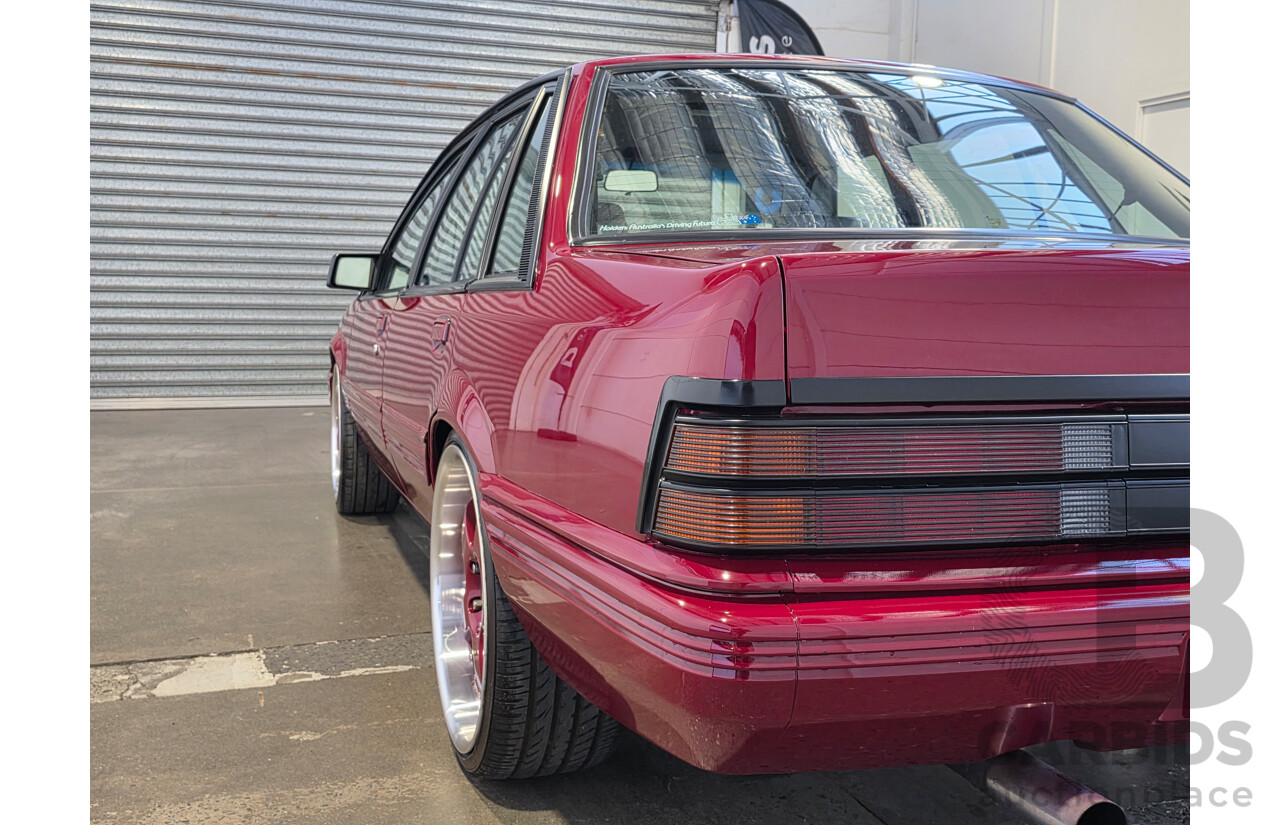 04/1987 Holden VL Commodore Executive 4d Sedan Burgundy V8 5.0L - Modified