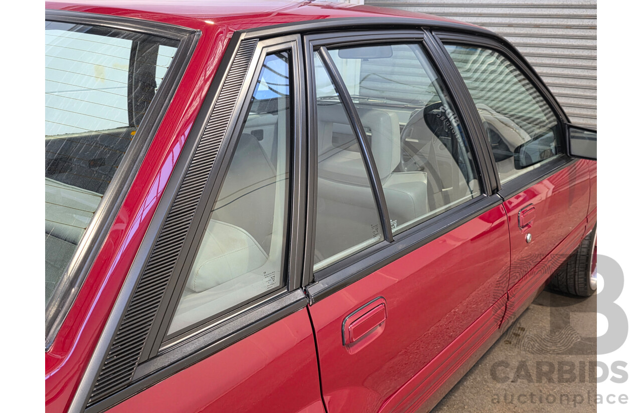 04/1987 Holden VL Commodore Executive 4d Sedan Burgundy V8 5.0L - Modified