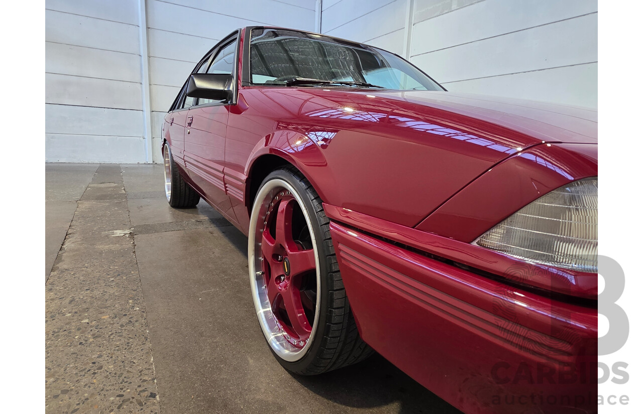 04/1987 Holden VL Commodore Executive 4d Sedan Burgundy V8 5.0L - Modified