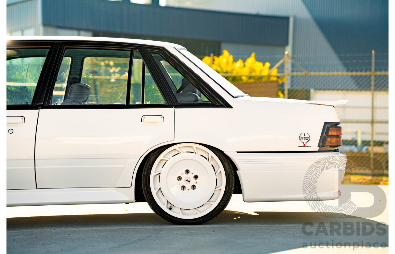 10/1984 Holden VK Commodore SL (134 Package) Groupe 3 Tribute 4d Sedan Alpine White V8 5.0L - Modified