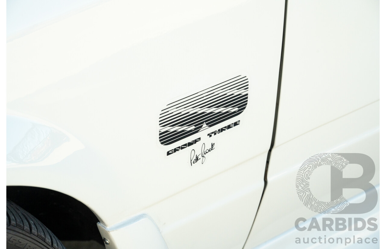 10/1984 Holden VK Commodore SL (134 Package) Groupe 3 Tribute 4d Sedan Alpine White V8 5.0L - Modified