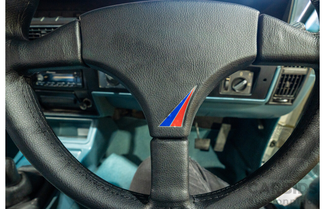 10/1984 Holden VK Commodore SL (134 Package) Groupe 3 Tribute 4d Sedan Alpine White V8 5.0L - Modified