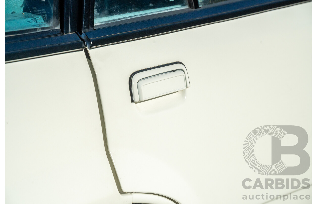 10/1984 Holden VK Commodore SL (134 Package) Groupe 3 Tribute 4d Sedan Alpine White V8 5.0L - Modified