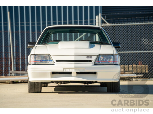 10/1984 Holden VK Commodore SL (134 Package) Group 3 Tribute 4d Sedan Alpine White V8 5.0L - Modified
