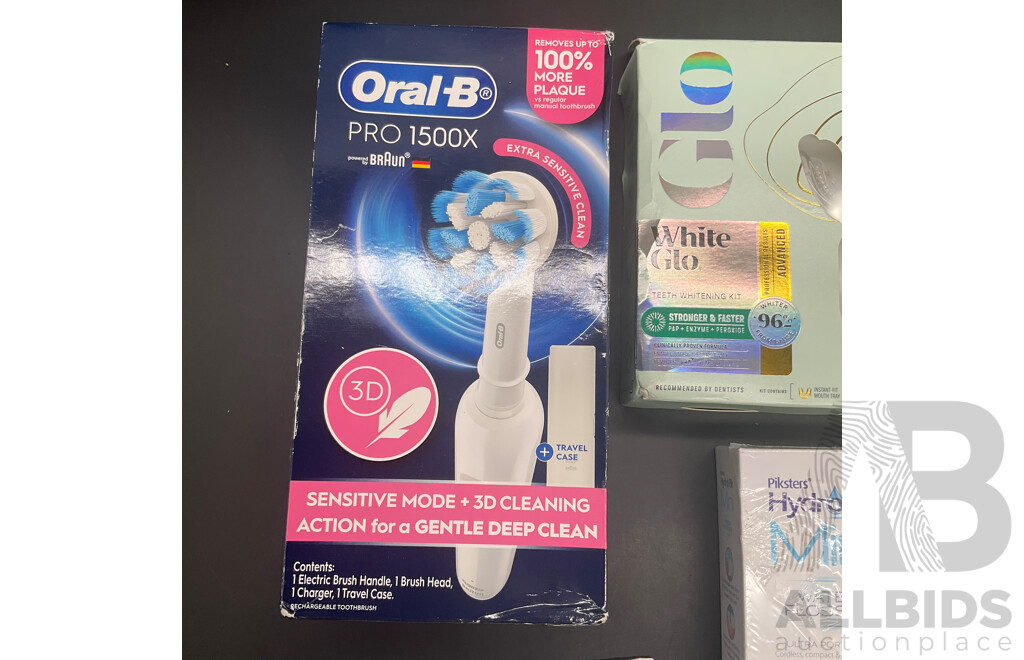 BRAUN Oral-B Pro 1500X Electric Toothbrush, WHITE GLO Advanced Teeth Whitening Kit, PIKSTERS HydroPik Mini Water Flosser and SENDOSDYNE Toothpaste - Lot of 4