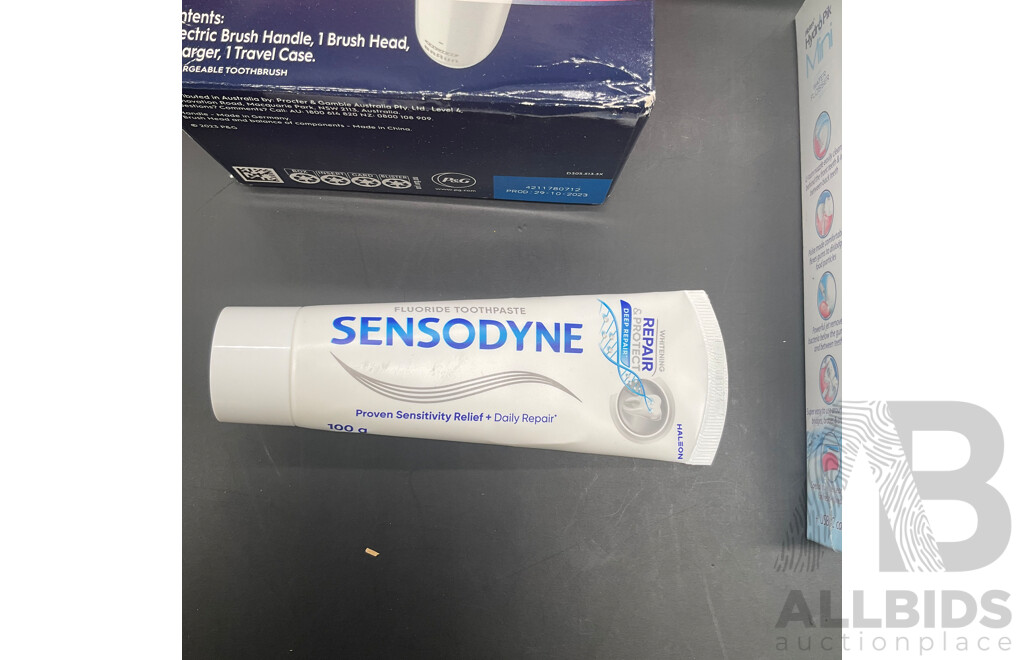 BRAUN Oral-B Pro 1500X Electric Toothbrush, WHITE GLO Advanced Teeth Whitening Kit, PIKSTERS HydroPik Mini Water Flosser and SENDOSDYNE Toothpaste   - Lot of 4