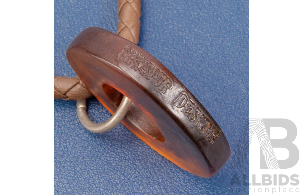 Vintage Dinosaur Designs Resin Pendant on Woven Leather Necklace