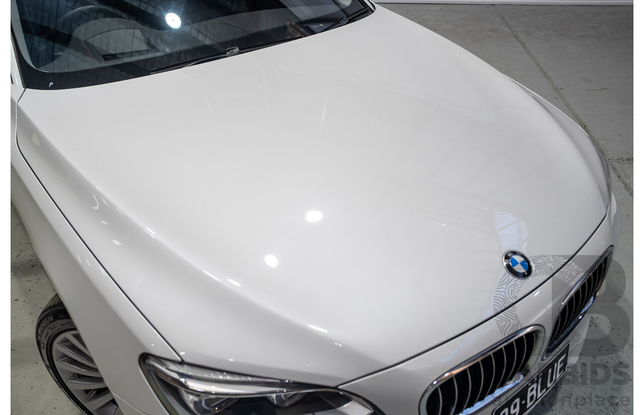 09/2013 BMW 740i F01 MY14 4d Sedan Mineral White Metallic Turbo 3.0L