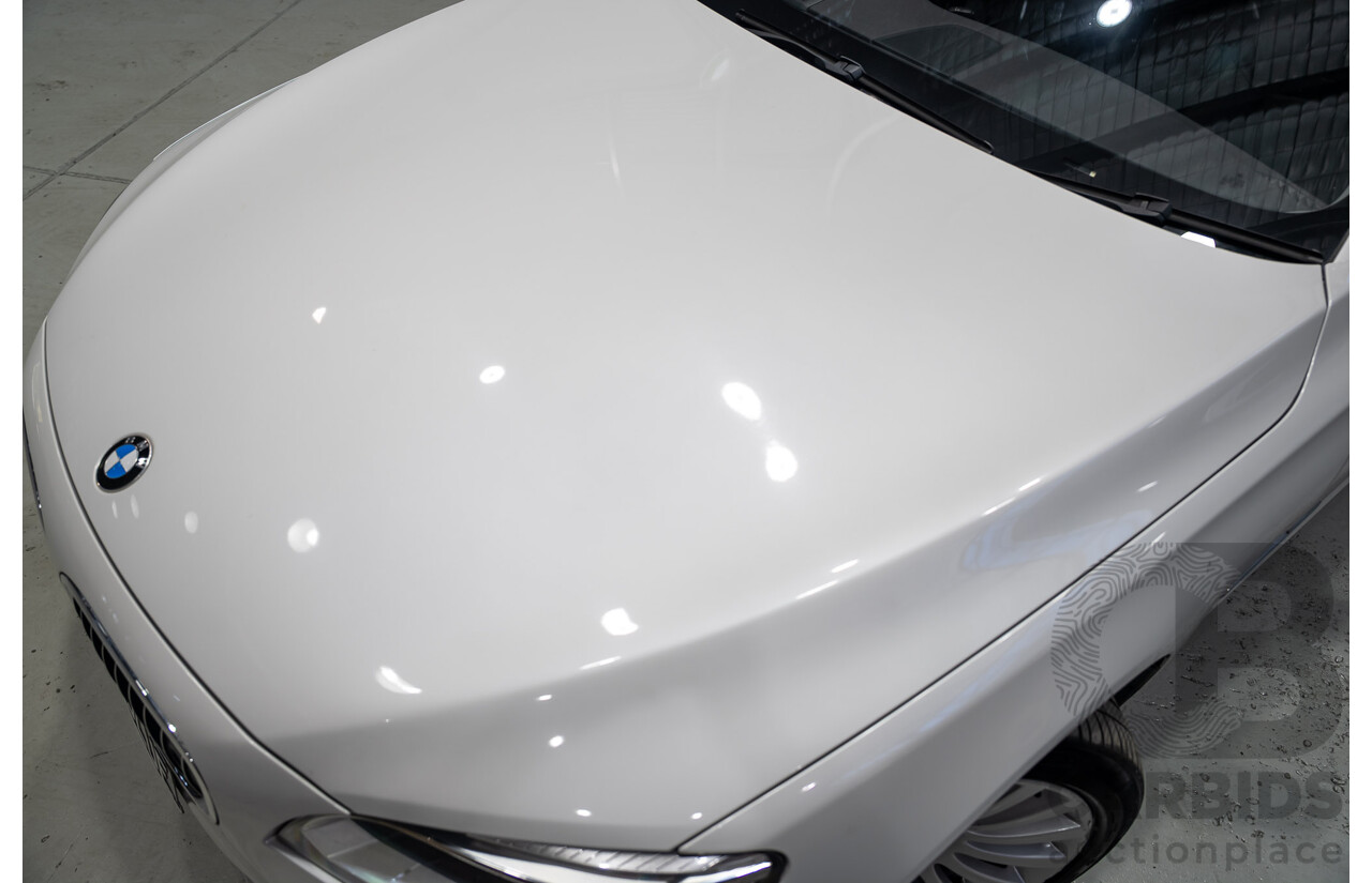 09/2013 BMW 740i F01 MY14 4d Sedan Mineral White Metallic Turbo 3.0L