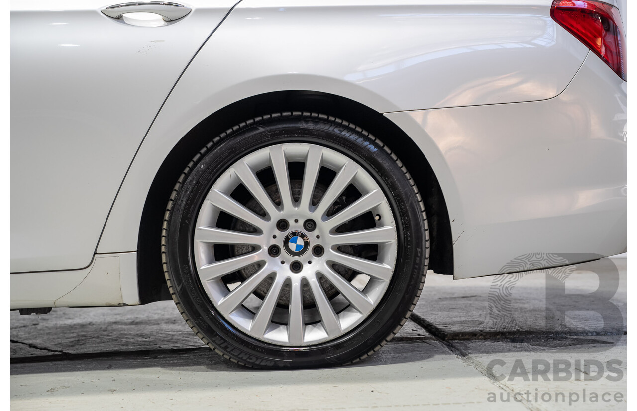09/2013 BMW 740i F01 MY14 4d Sedan Mineral White Metallic Turbo 3.0L
