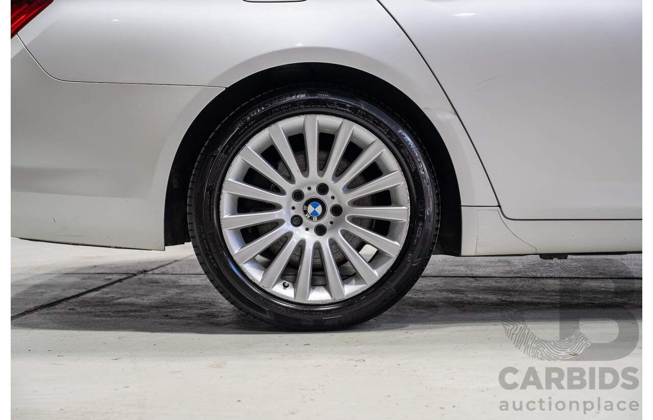 09/2013 BMW 740i F01 MY14 4d Sedan Mineral White Metallic Turbo 3.0L