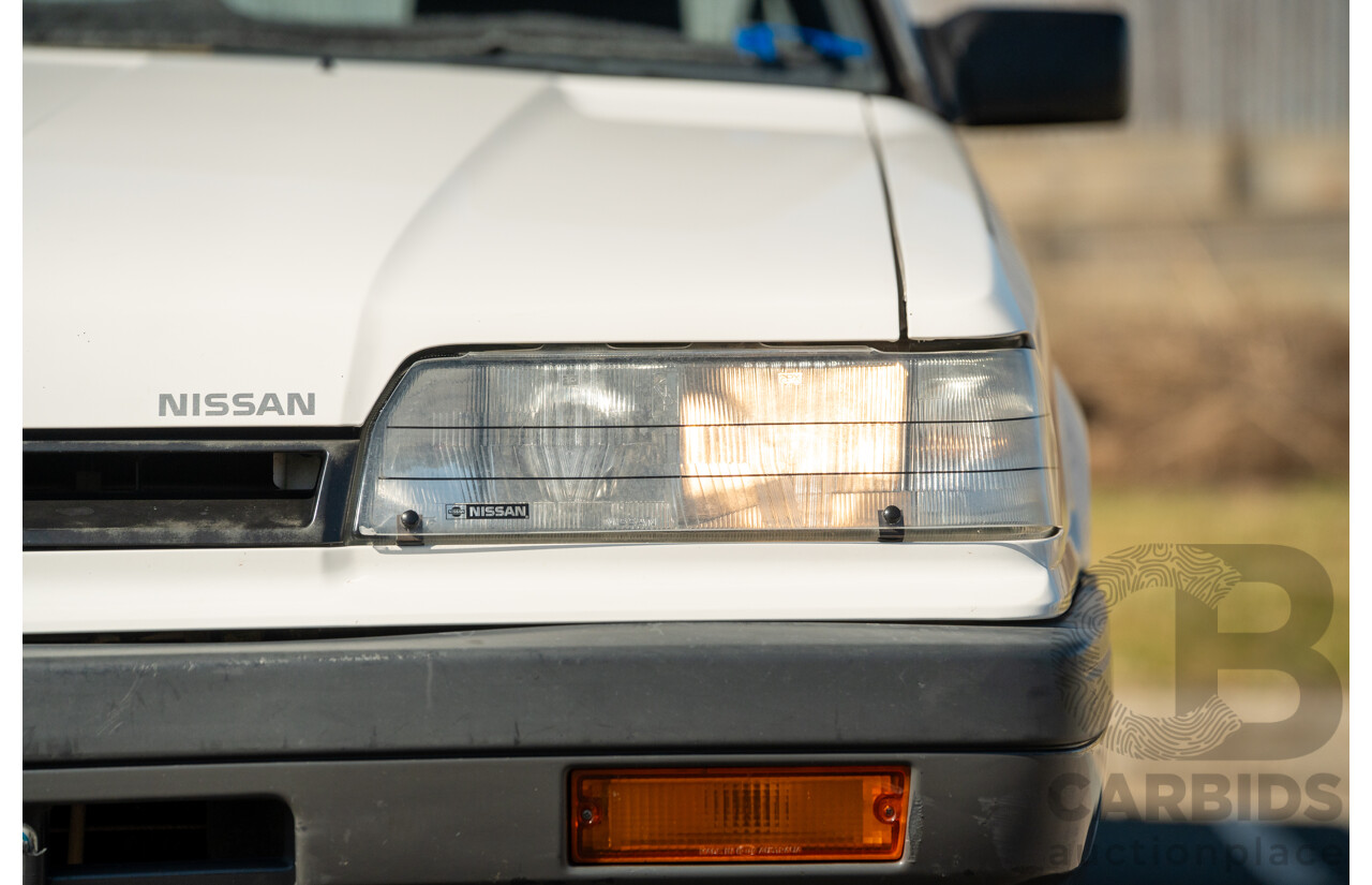 5/1990 Nissan Skyline GXE R31 4d Sedan White 3.0L