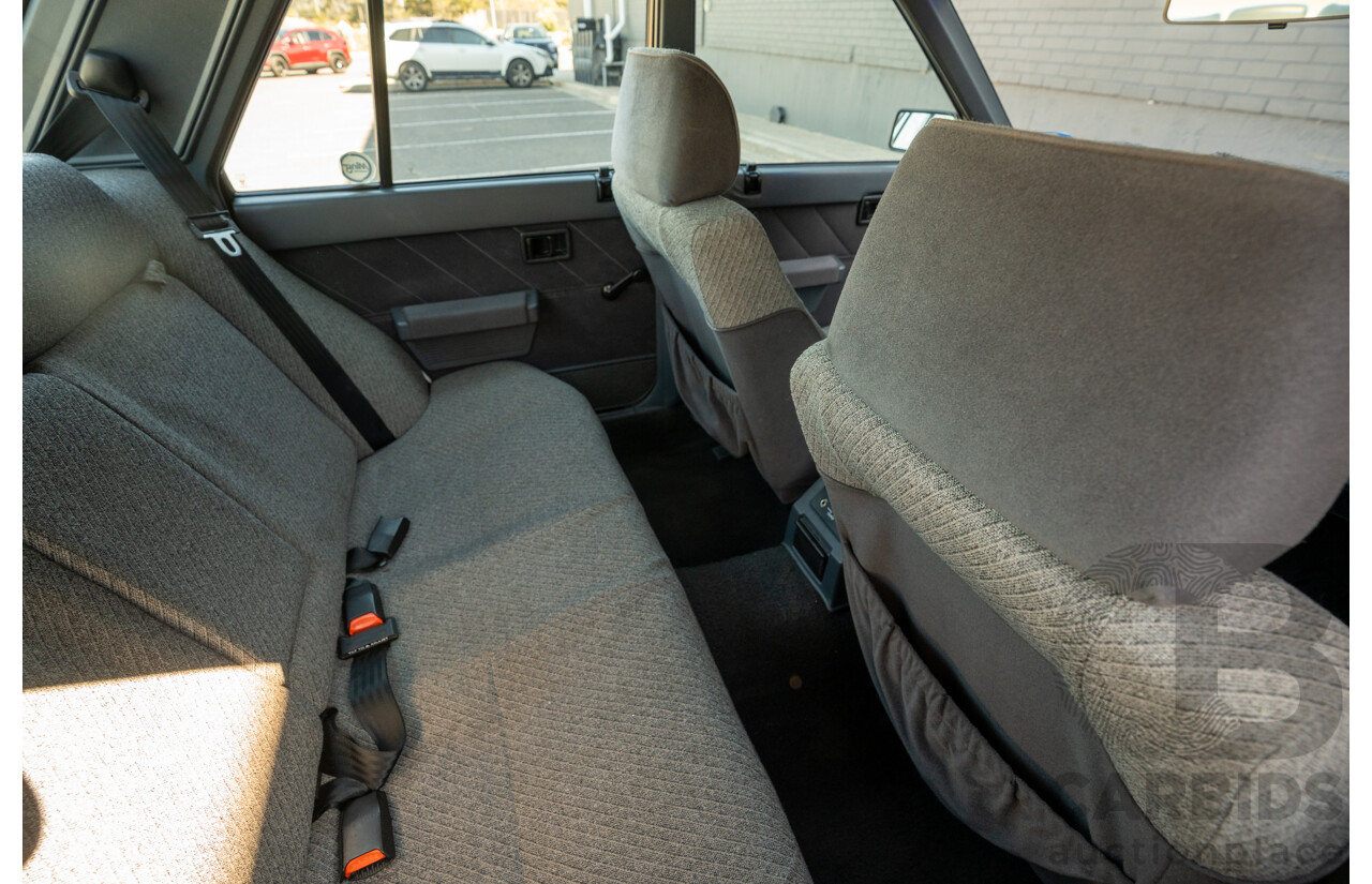 5/1990 Nissan Skyline GXE R31 4d Sedan White 3.0L