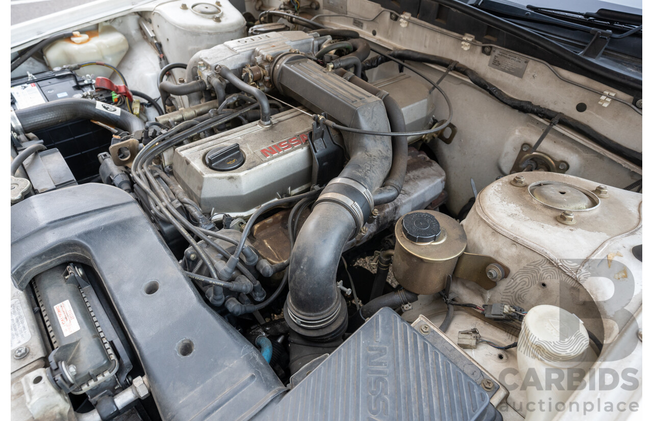 5/1990 Nissan Skyline GXE R31 4d Sedan White 3.0L