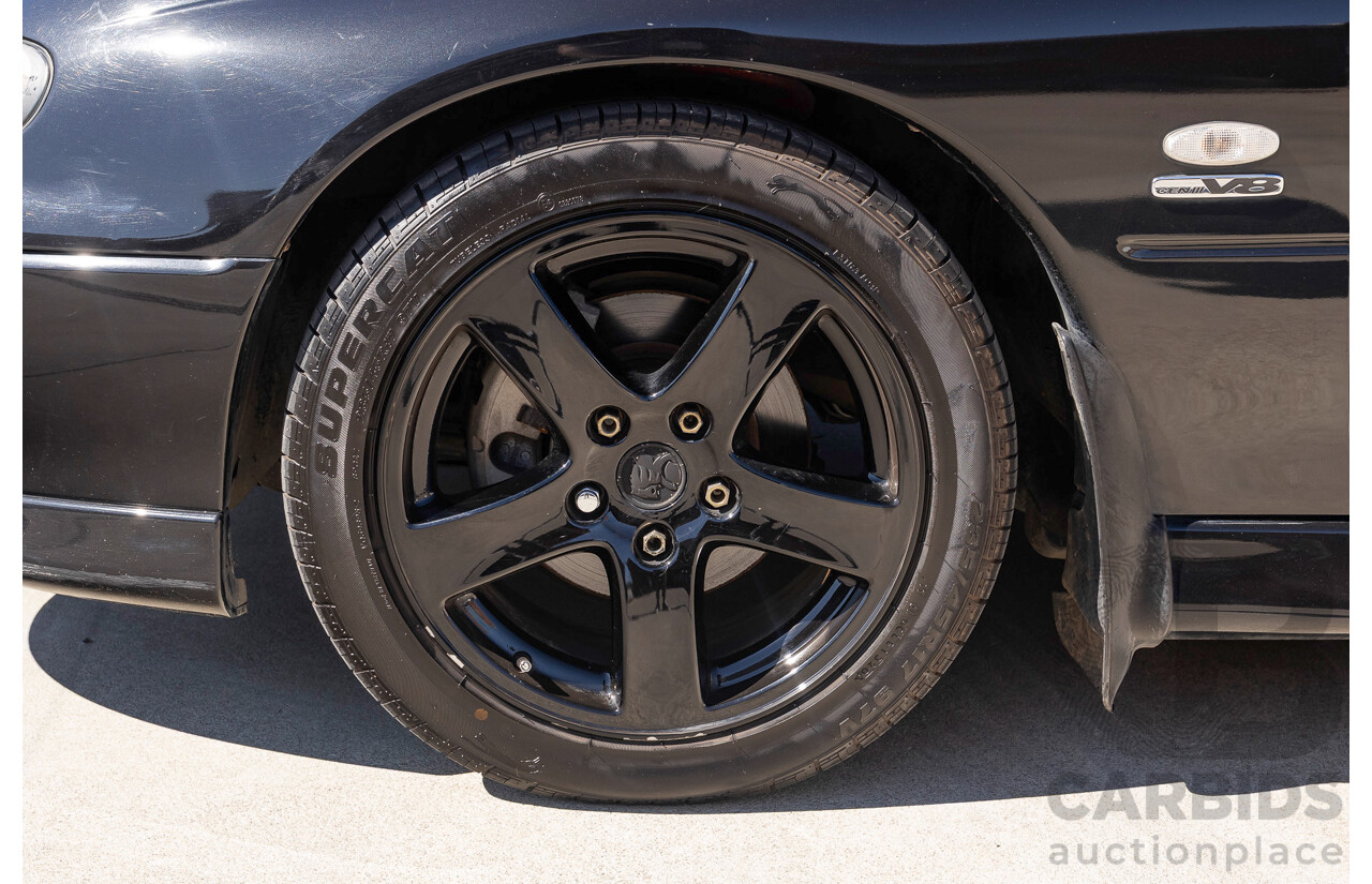 2/2002 Holden Commodore SS VXII 4d Sedan Phantom Black Metallic V8 5.7L