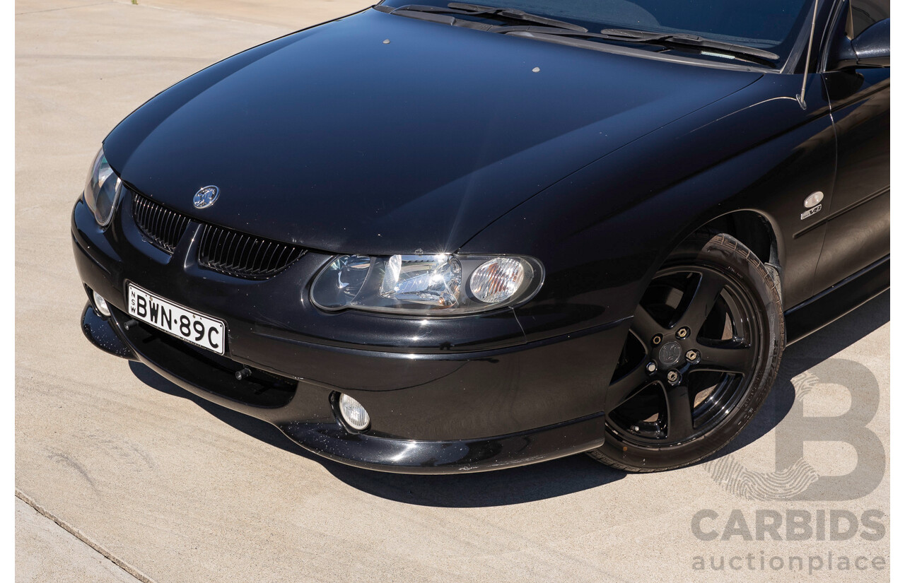 2/2002 Holden Commodore SS VXII 4d Sedan Phantom Black Metallic V8 5.7L