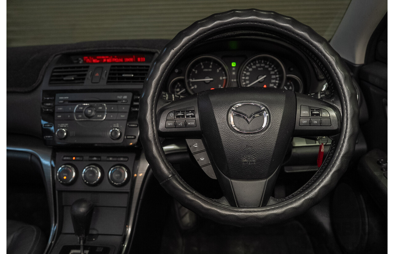 09/2012 Mazda Touring GH MY11 4d Wagon Black 2.5L