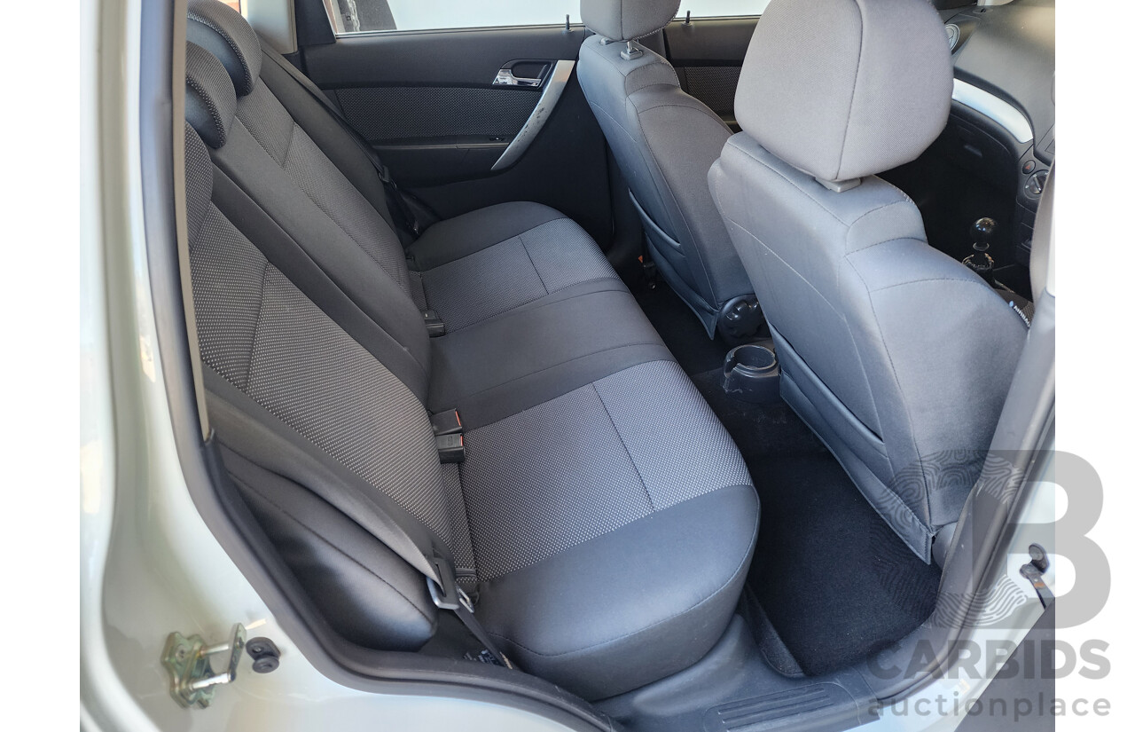 10/2011 Holden Barina  TK MY11 5d Hatchback White 1.6L